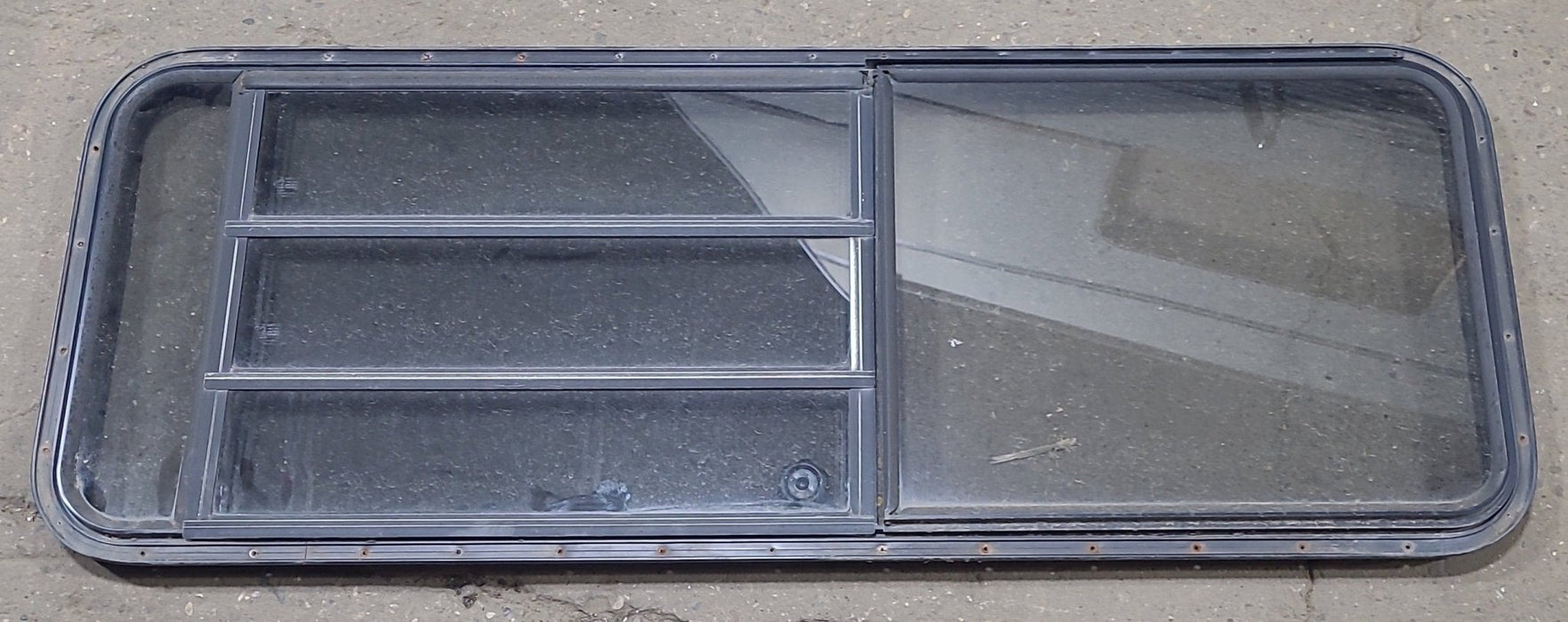 Used Black Radius Emergency Opening Window : 60 3/4" W x 23" H x 1 3/8" D