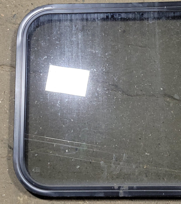 Used Black Radius Non-Opening Window : 23 1/4" W X 21 3/4" H X 1 3/8" D - Young Farts RV Parts