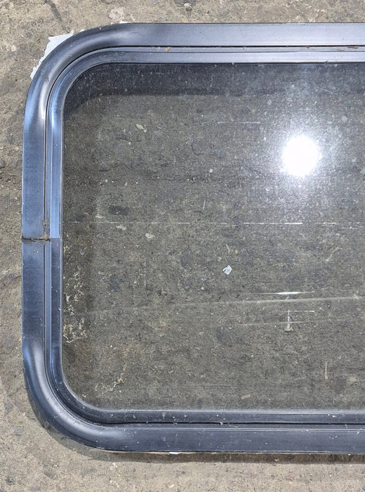 Used Black Radius Non Opening Window : 24 1/4" W x 16 3/4" H x 1 7/8"