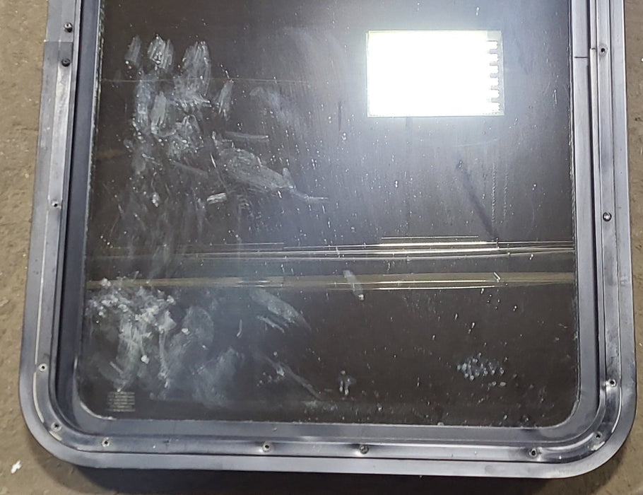 Used Black Radius Non Opening Window : 24" W x 35 1/2" H x 2" D - Young Farts RV Parts