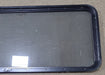 Used Black Radius Non Opening Window : 60 1/4" W x 21 3/4" H x 1 3/4" D - Young Farts RV Parts