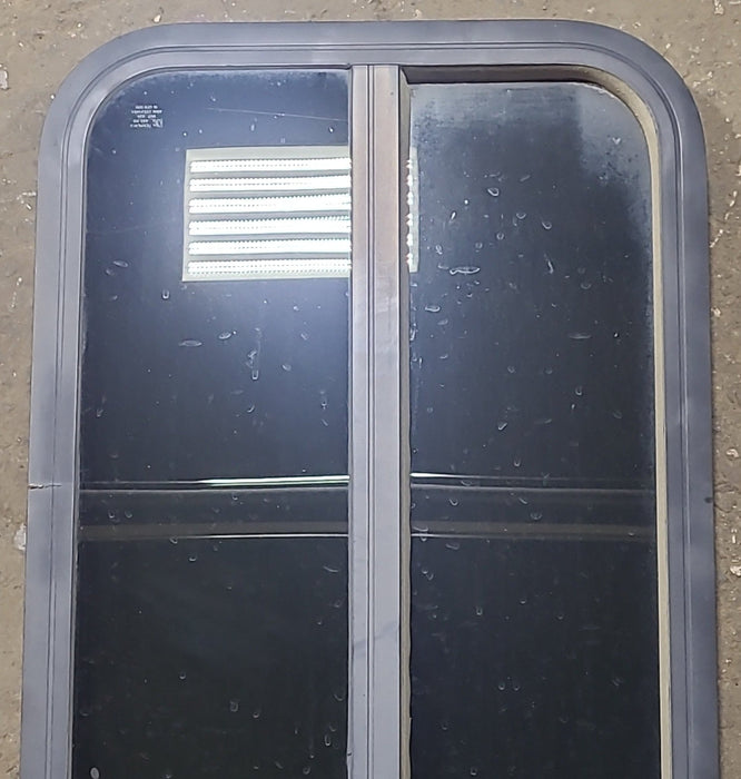 Used Black Radius Opening Window : 17 3/8" W x 39 1/2" H x 1 5/8" D - Young Farts RV Parts