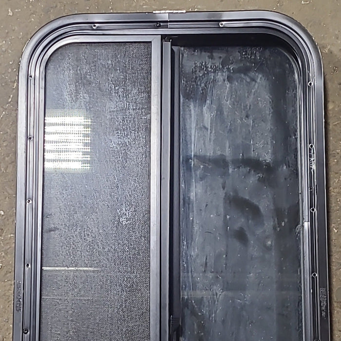 Used Black Radius Opening Window : 17 3/8" W x 39 1/2" H x 1 5/8" D - Young Farts RV Parts