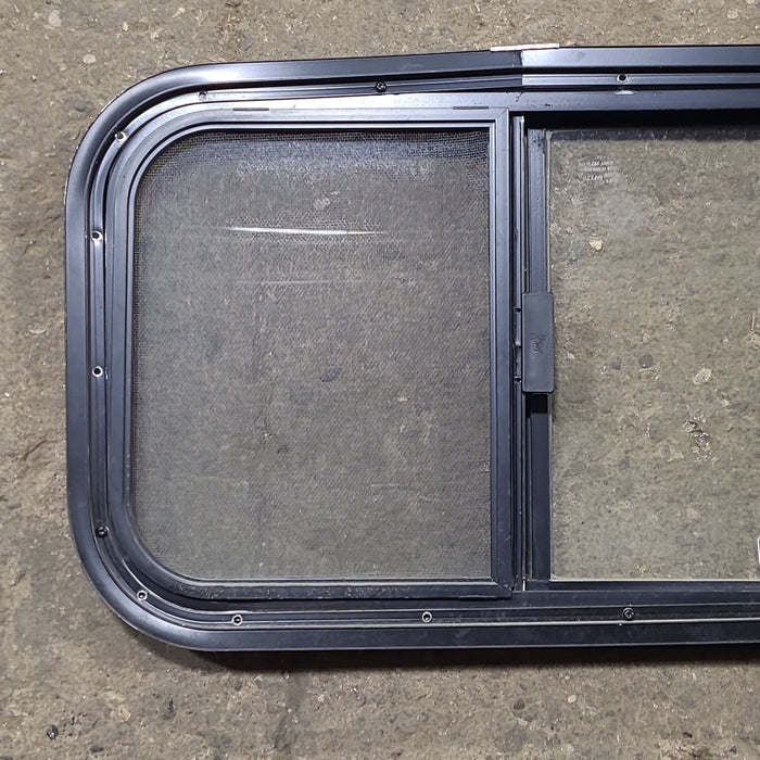 Used Black Radius Opening Window : 23 1/2" W x 14 1/2" H x 1 1/4" D - Young Farts RV Parts