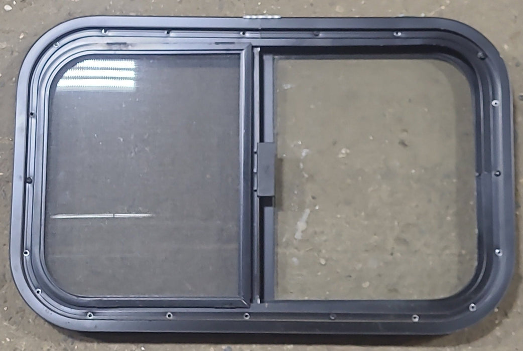 Used Black Radius Opening Window : 23 1/2" W x 14 1/2" H x 1 1/8" D - Young Farts RV Parts