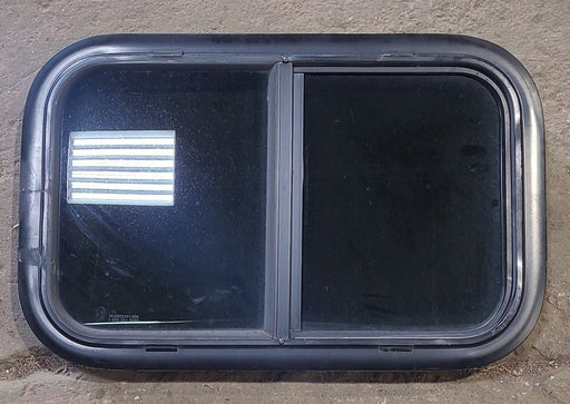 Used Black Radius Opening Window : 23 1/2" W x 14 1/2" H x 1 7/8" D - Young Farts RV Parts