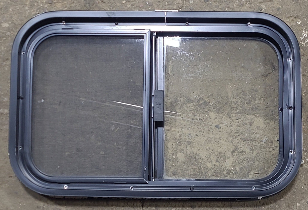 Used Black Radius Opening Window : 23 1/2" W x 14 1/2" H x 1 7/8" D - Young Farts RV Parts