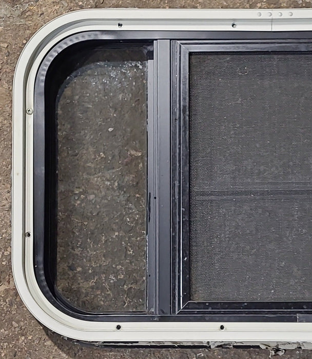Used Black Radius Opening Window : 23 1/2" W x 14 5/8" H x 1 3/4" D