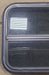 Used Black Radius Opening Window : 23 1/2" W x 19 1/2" H x 1 7/8" D - Young Farts RV Parts
