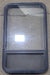 Used Black Radius Opening Window : 23 1/2" W x 39 1/2" H x 1 7/8" D - Young Farts RV Parts