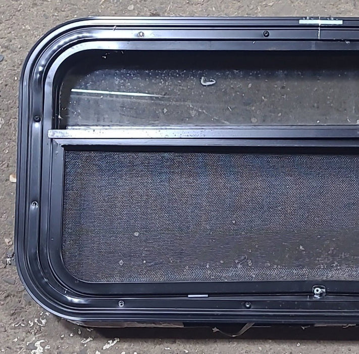 Used Black Radius Opening Window : 23 1/4" W x 14 1/4" H x 1 7/8" D - Young Farts RV Parts