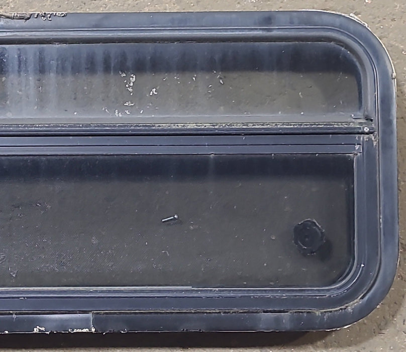 Used Black Radius Opening Window : 23 1/4" W x 14 1/4" H x 1 7/8" D - Young Farts RV Parts