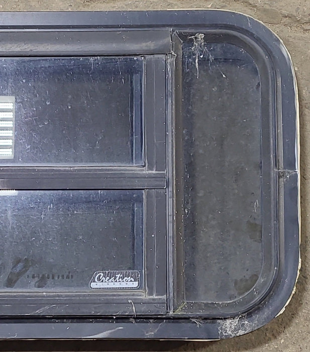Used Black Radius Opening Window : 23" W x 14 1/8" H x 1 3/4" D
