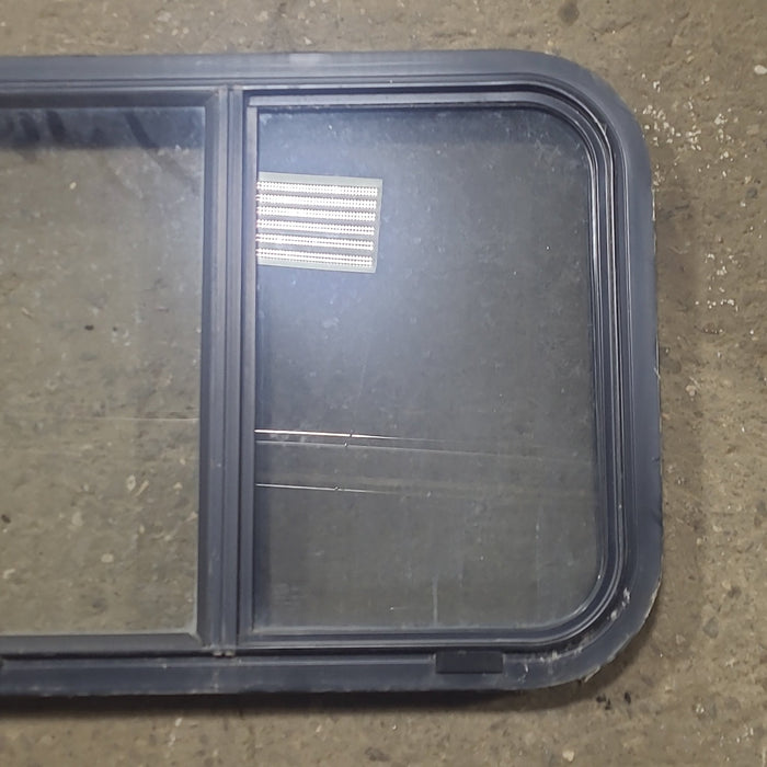 Used Black Radius Opening Window : 24 1/2" W x 18" H x 1 3/4" D - Young Farts RV Parts