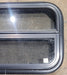 Used Black Radius Opening Window : 24 1/4" W x 14 1/4" H x 1 7/8" - Young Farts RV Parts