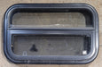 Used Black Radius Opening Window : 24 1/4" W x 14 1/4" H x 1 7/8" - Young Farts RV Parts