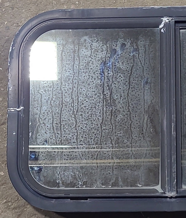 Used Black Radius Opening Window : 24 1/4" W x 14 3/4" H x 2" D