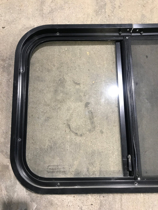 Used Black Radius Opening Window : 24 1/4" W x 17 3/4" H x 1 1/4"