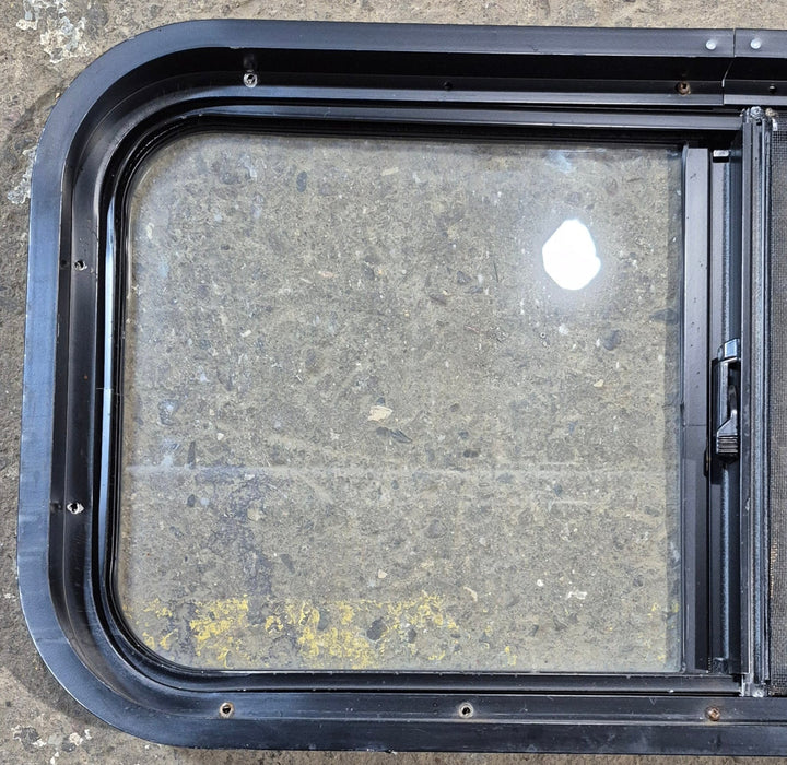 Used Black Radius Opening Window : 29 1/2" W x 14 3/4" H x 1 7/8"