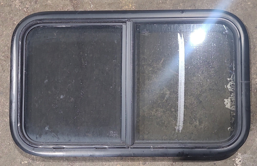 Used Black Radius Opening Window : 29 1/2" W x 17 1/2" H x 1 3/4" D - Young Farts RV Parts