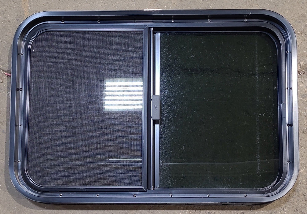 Used Black Radius Opening Window : 29 1/2" W x 19 1/2" H x 1 7/8" D - Young Farts RV Parts