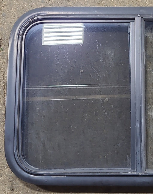 Used Black Radius Opening Window : 29 1/2" W x 19 1/2" H x 1 7/8" D - Young Farts RV Parts