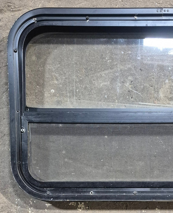 Used Black Radius Opening Window : 29 1/4" W x 17 1/2" H x 1 7/8" D - Young Farts RV Parts