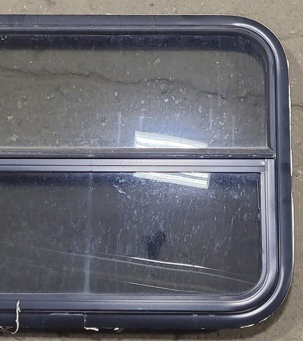 Used Black Radius Opening Window : 29 1/4" W x 21 1/2" H x 1 3/4" D - Young Farts RV Parts