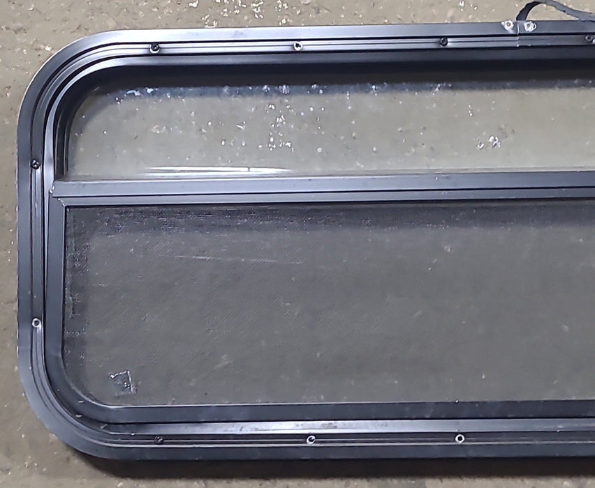 Used Black Radius Opening Window : 35 1/2" W x 14 1/4" H x 2" D - Young Farts RV Parts
