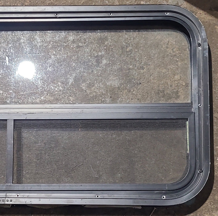Used Black Radius Opening Window : 35 1/2" W x 17 1/4" H x 1 7/8" D