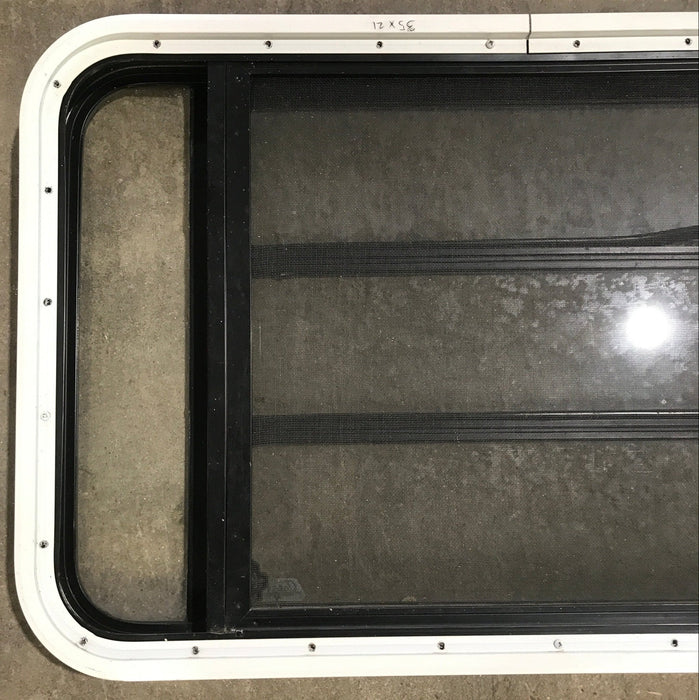 Used Black Radius Opening Window : 35 1/4" W x 21 1/4" H x 1 7/8" D
