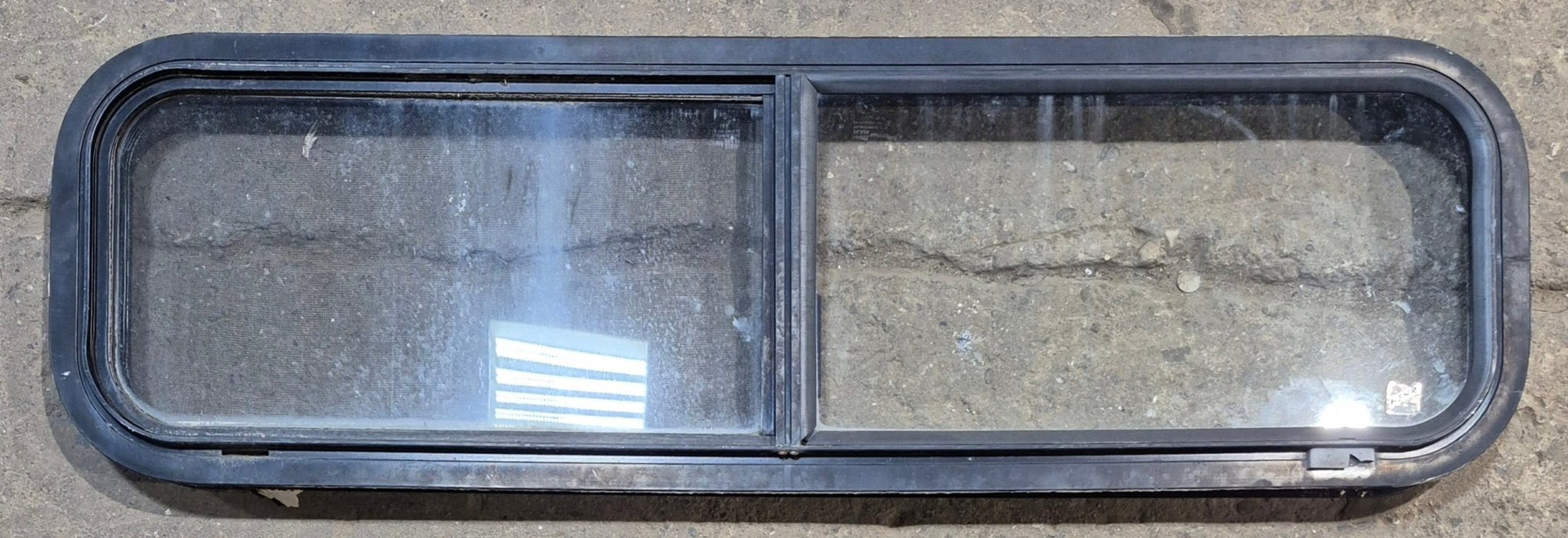Used Black Radius Opening Window : 42 1/4" W x 11 3/4" H x 1 7/8" - Young Farts RV Parts