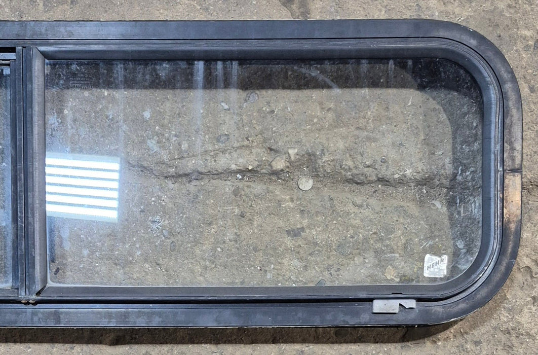 Used Black Radius Opening Window : 42 1/4" W x 11 3/4" H x 1 7/8" - Young Farts RV Parts