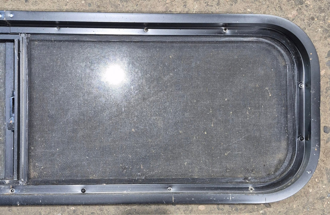 Used Black Radius Opening Window : 42 1/4" W x 11 3/4" H x 1 7/8" - Young Farts RV Parts