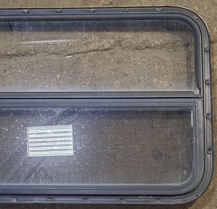 Used Black Radius Opening Window : 42 1/4" W x 22 1/4" H x 1 1/4" D