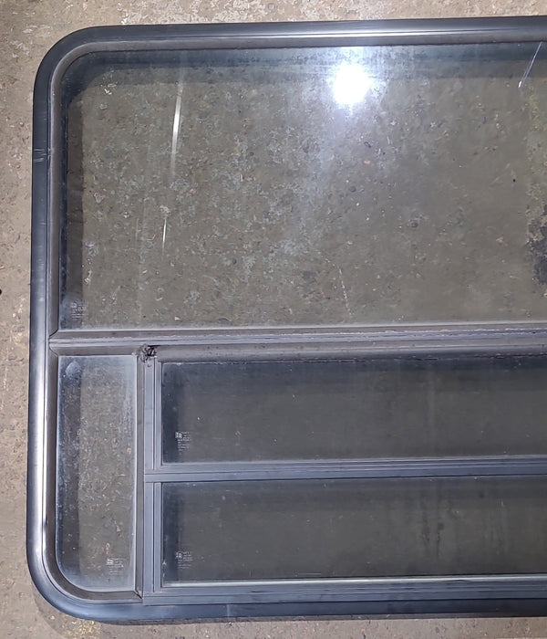 Used Black Radius Opening Window : 47 1/2" W x 34 1/4" H x 1 3/4" D - Young Farts RV Parts