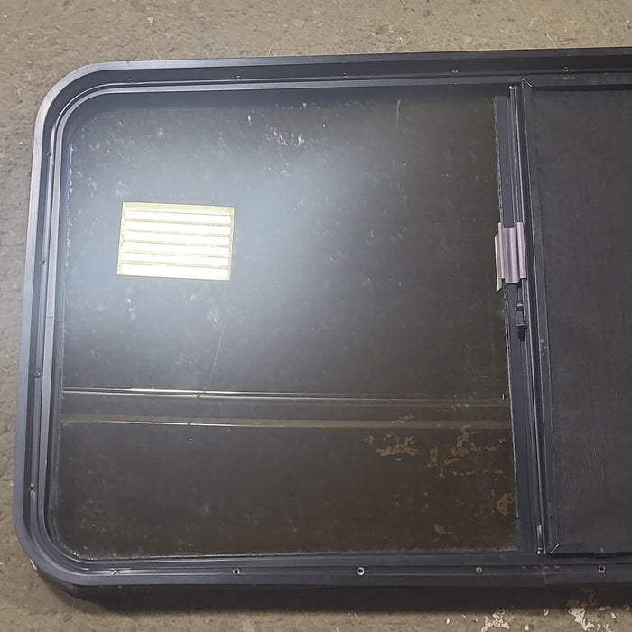 Used Black Radius Opening Window : 48 1/2" W x 26 1/4" H x 1 3/4" D