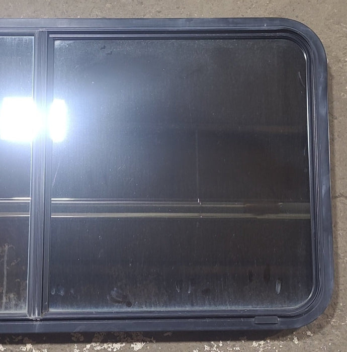 Used Black Radius Opening Window : 48 1/2" W x 26 1/4" H x 1 3/4" D