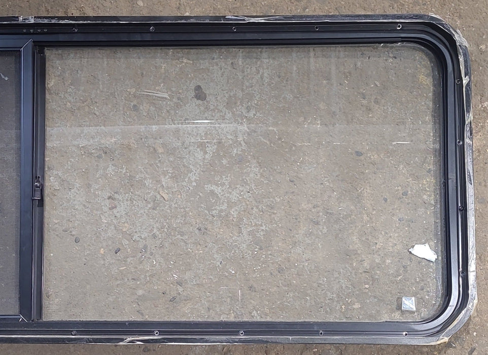Used Black Radius Opening Window : 60 1/4" W x 21 3/4" H x 1 3/4" D - Young Farts RV Parts