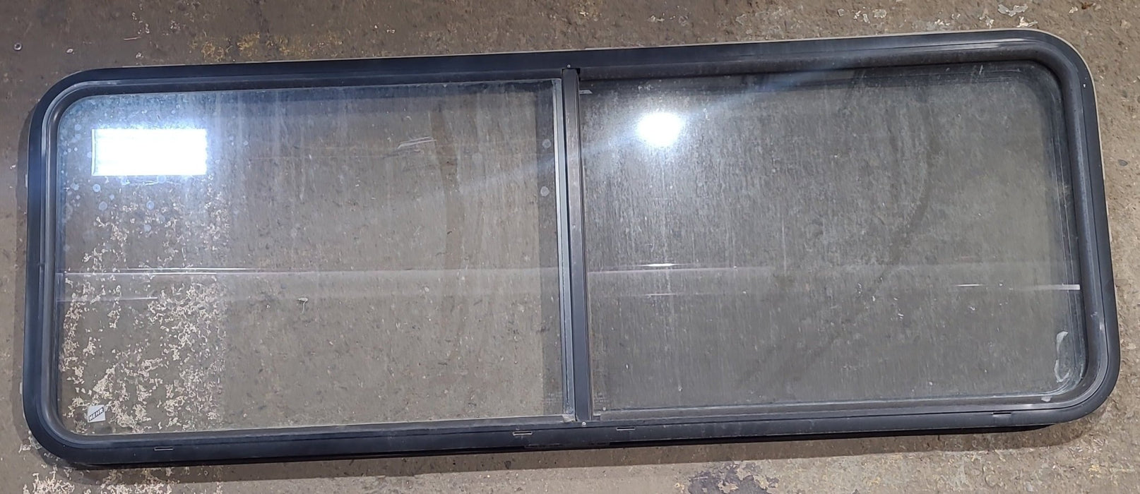 Used Black Radius Opening Window : 60 1/4" W x 21 3/4" H x 1 3/4" D - Young Farts RV Parts