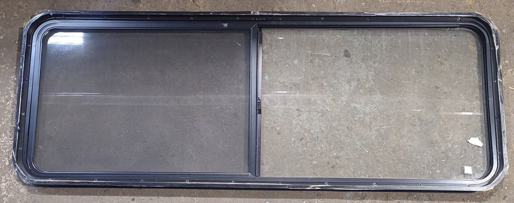 Used Black Radius Opening Window : 60 1/4" W x 21 3/4" H x 1 3/4" D - Young Farts RV Parts