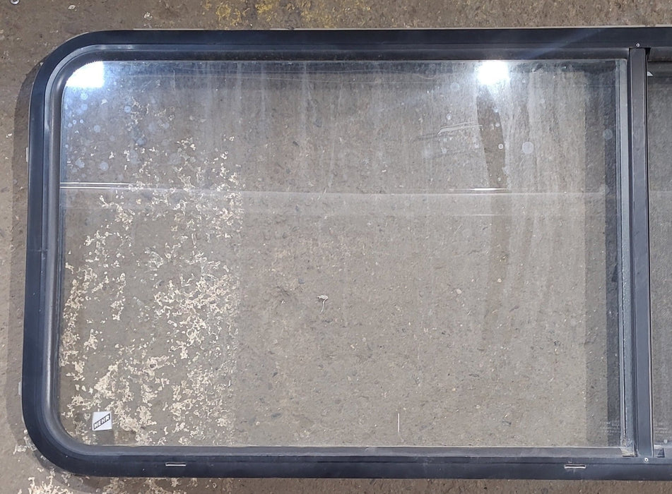 Used Black Radius Opening Window : 60 1/4" W x 21 3/4" H x 1 3/4" D - Young Farts RV Parts