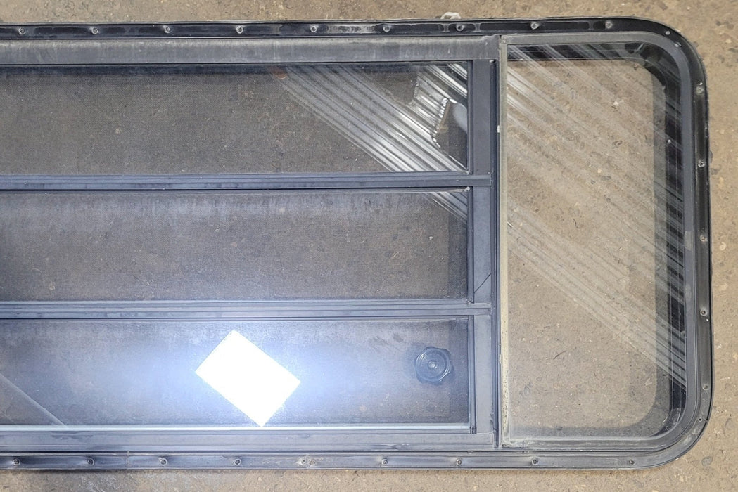 Used Black Radius Opening Window : 61 3/4" W x 23 3/4" H x 1 3/4" D - Young Farts RV Parts