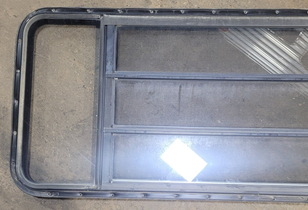 Used Black Radius Opening Window : 61 3/4" W x 23 3/4" H x 1 3/4" D - Young Farts RV Parts