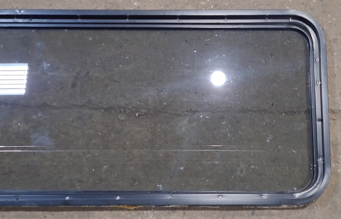 Used Black Radius Opening Window : 72" W x 21 3/4" H x 1 7/8" D - Young Farts RV Parts
