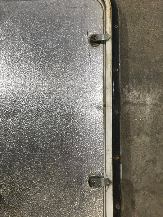 Used Radius Corner cargo door  23 3/4" W  x 21 3/4" H x  1/2" D