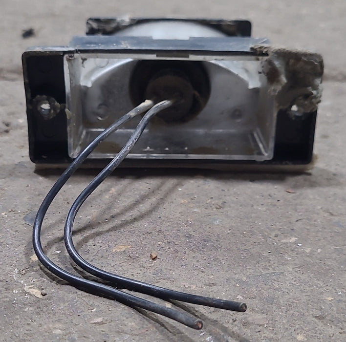 Used SAE L 82 - Bargman 60 series DOT license plate light - Black
