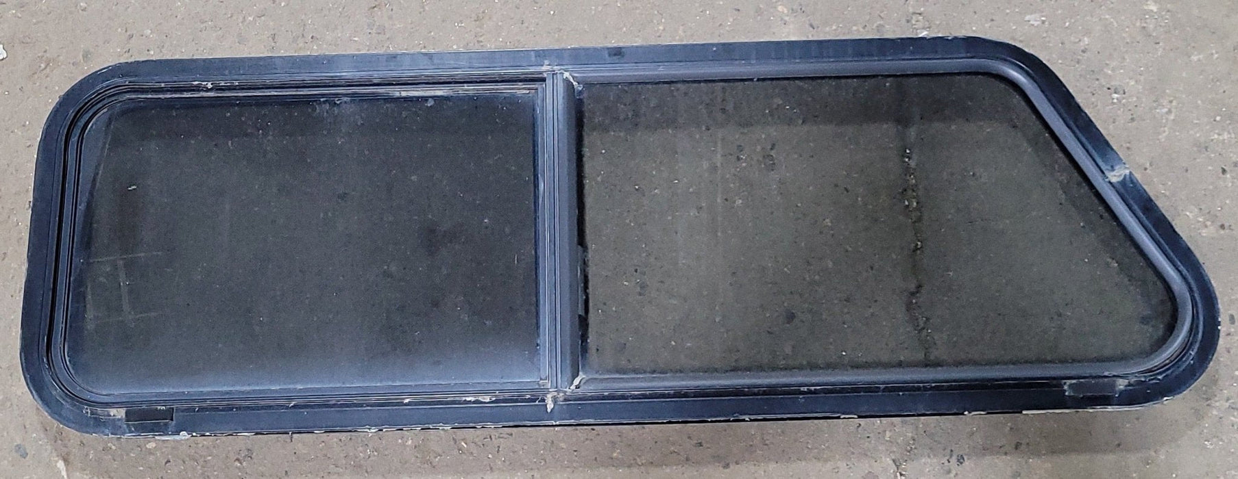 Used Slanted Black Radius Opening Window : 15 1/4" H X 48" W X 2" D - Young Farts RV Parts