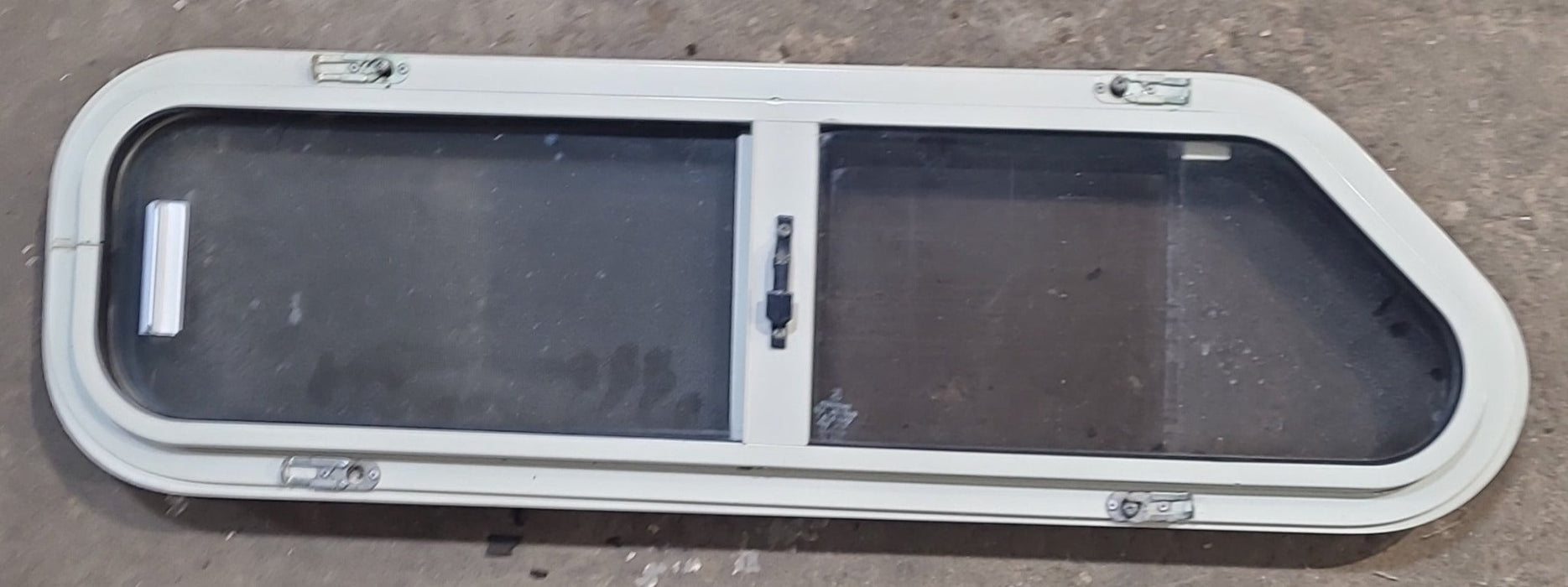 Used Slanted Black Radius Opening Window : 32" W x 8 1/2" H x 1 3/8" D - Young Farts RV Parts