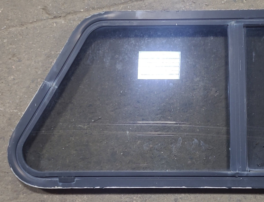 Used Slanted Black Radius Opening Window : 41 3/4" W x 17 3/4" H x 1 7/8" D - Young Farts RV Parts